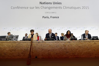 French Foreign Minister Laurent Fabius (C), President-designate of COP21, and Secretary of the U.N. Framework Convention on Climate Change, Christiana Figueres (L), attend the World Climate Change Conference 2015 (COP21) at Le Bourget, near Paris, France, 9 December 2015. Photo: Stephane Mahe / Reuters