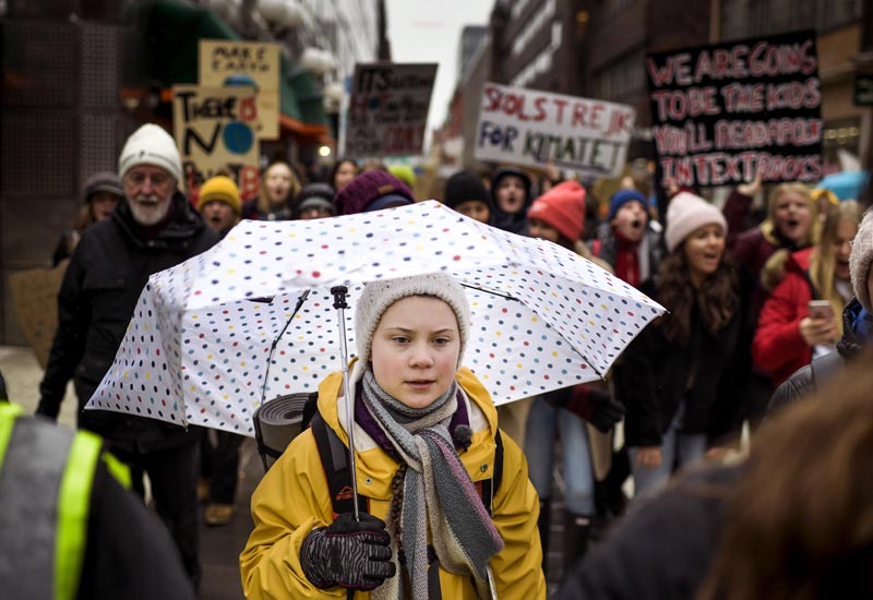 Activist Greta Thunberg, foreground, participates in a climate protest, in central Stockholm Sweden, Friday, 15 March 2019. Photo: Pontus Lundahl / TT News Agency via AP