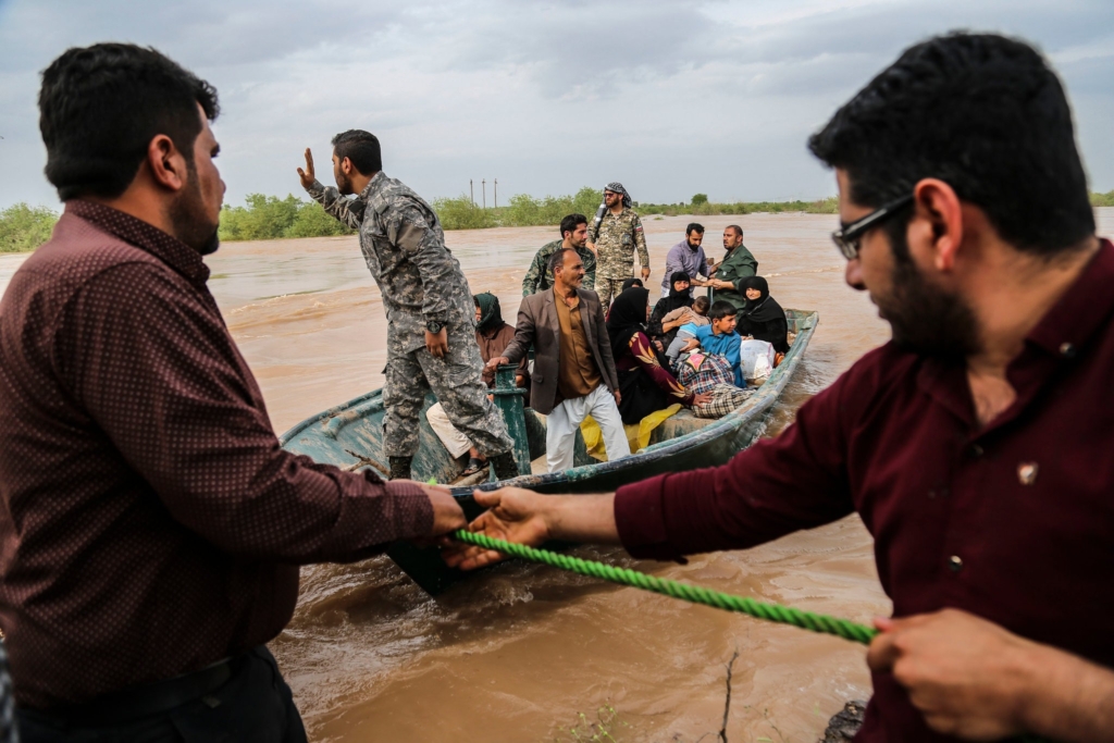 Iranian soldiers helping civilians in a flooded area near the city of Ahvaz, in Iran’s Khuzestan Province, on 31 March 2019. Photo: Mehdi Pedramkhoo / Agence France-Presse / Getty Images