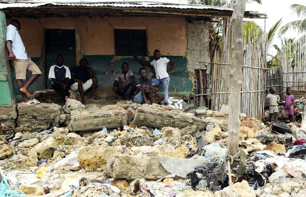 Community members look at rubble and other items washed close to their doorstep when Cyclone Kenneth struck in Pemba city on the northeastern coast of Mozambique, Saturday, 27 April 2019. Cyclone Kenneth arrived late Thursday, just six weeks after Cyclone Idai ripped into central Mozambique and killed more than 600 people.At least four deaths have been reported in the city and another in hard hit Macomia district, while residents on Ibo Island say two people have died there. Photo: Tsvangirayi Mukwazhi / AP Photo