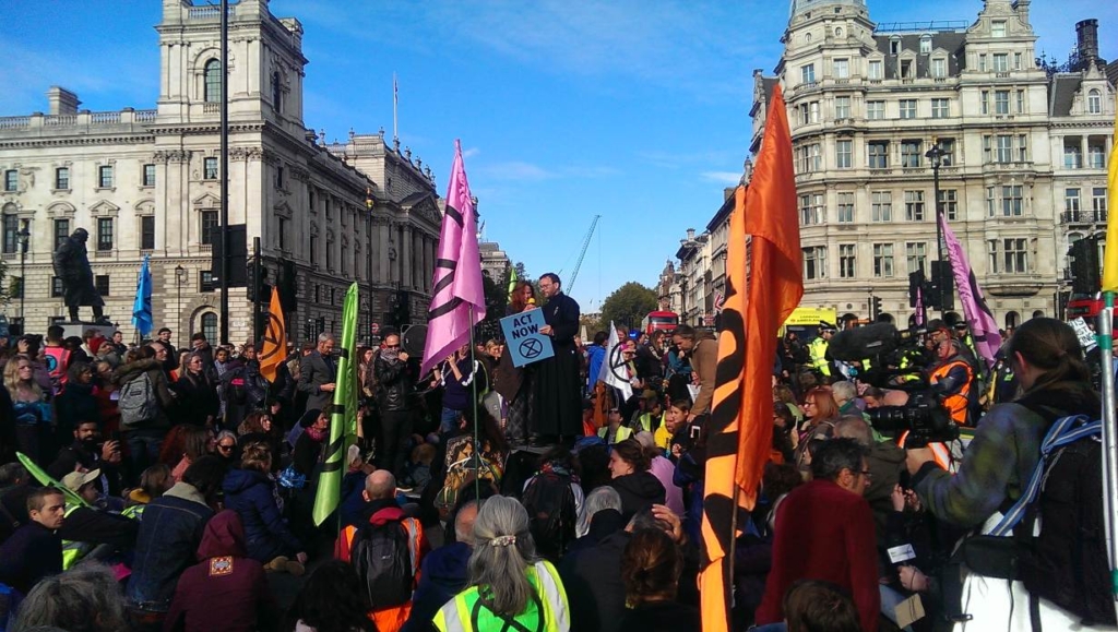 Father Martin Newell, 51, speaks at an Extinction Rebellion protest on Parliament Square in London, United Kingdom, 9 March 2019. Credit: Holly-Anna Petersen / Christian Climate Action