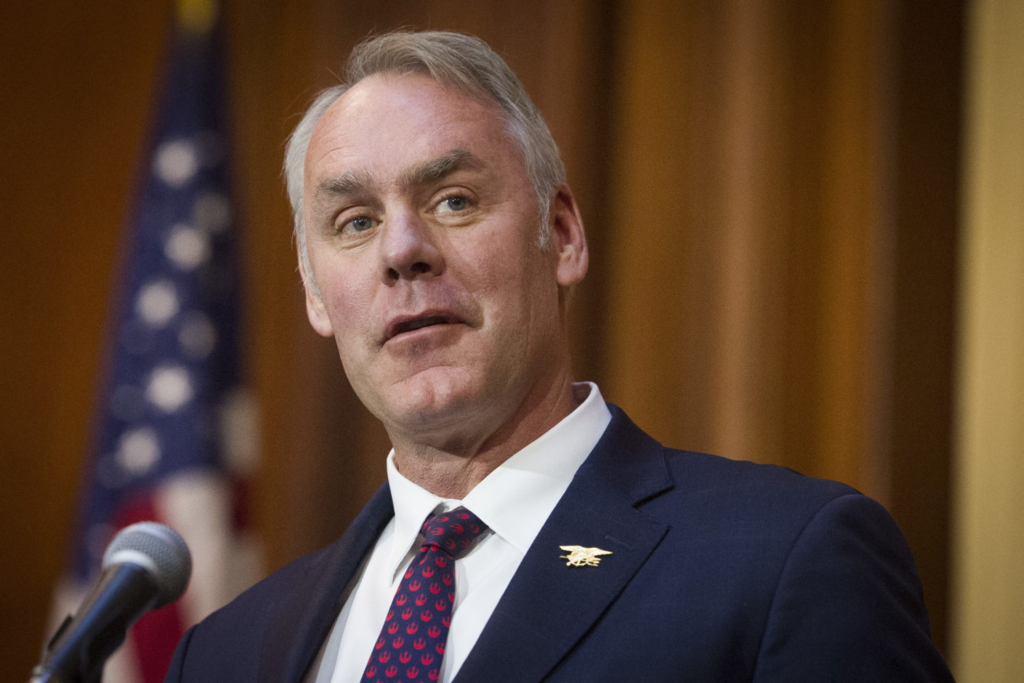 In this  11 Decemver 2018 file photo, Secretary of the Interior Ryan Zinke speaks after an order withdrawing federal protections for countless waterways and wetland was signed, at EPA headquarters in Washington. Trump said on Saturday, 15  December 2018, Zinke was leaving the administration at the end of the year Photo: Cliff Owen / AP Photo