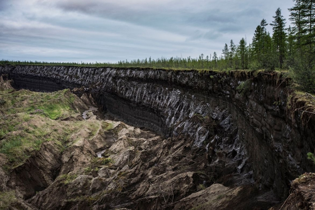 The Batagaika crater in eastern Russia was formed when land began to sink in the 1960s owing to thawing permafrost. Photo: Yuri Kozyrev / NOOR / eyevine