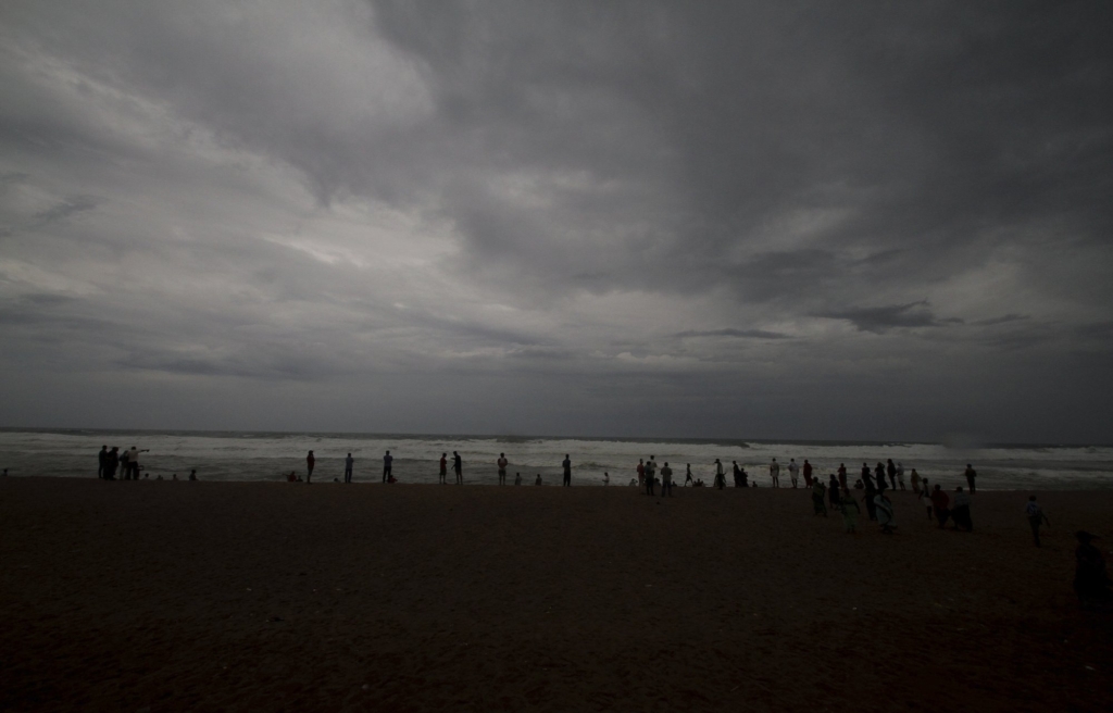 Dark clouds loom over locals standing at a beach in Puri district of eastern Odisha state, India, Thursday, 2 May 2019. Hundreds of thousands of people were evacuated along India's eastern coast on Thursday as authorities braced for a cyclone moving through the Bay of Bengal that was forecast to bring extremely severe wind and rain. Photo: AP Photo