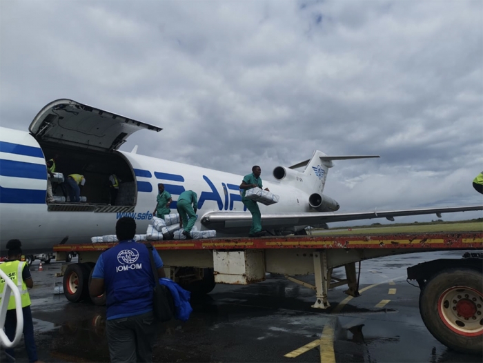 Shelter kits are unloaded from a relief flight at Pemba airport on 2 May 2019 in northern Mozambique, to support the Cyclone Kenneth aid response. Photo: IOM