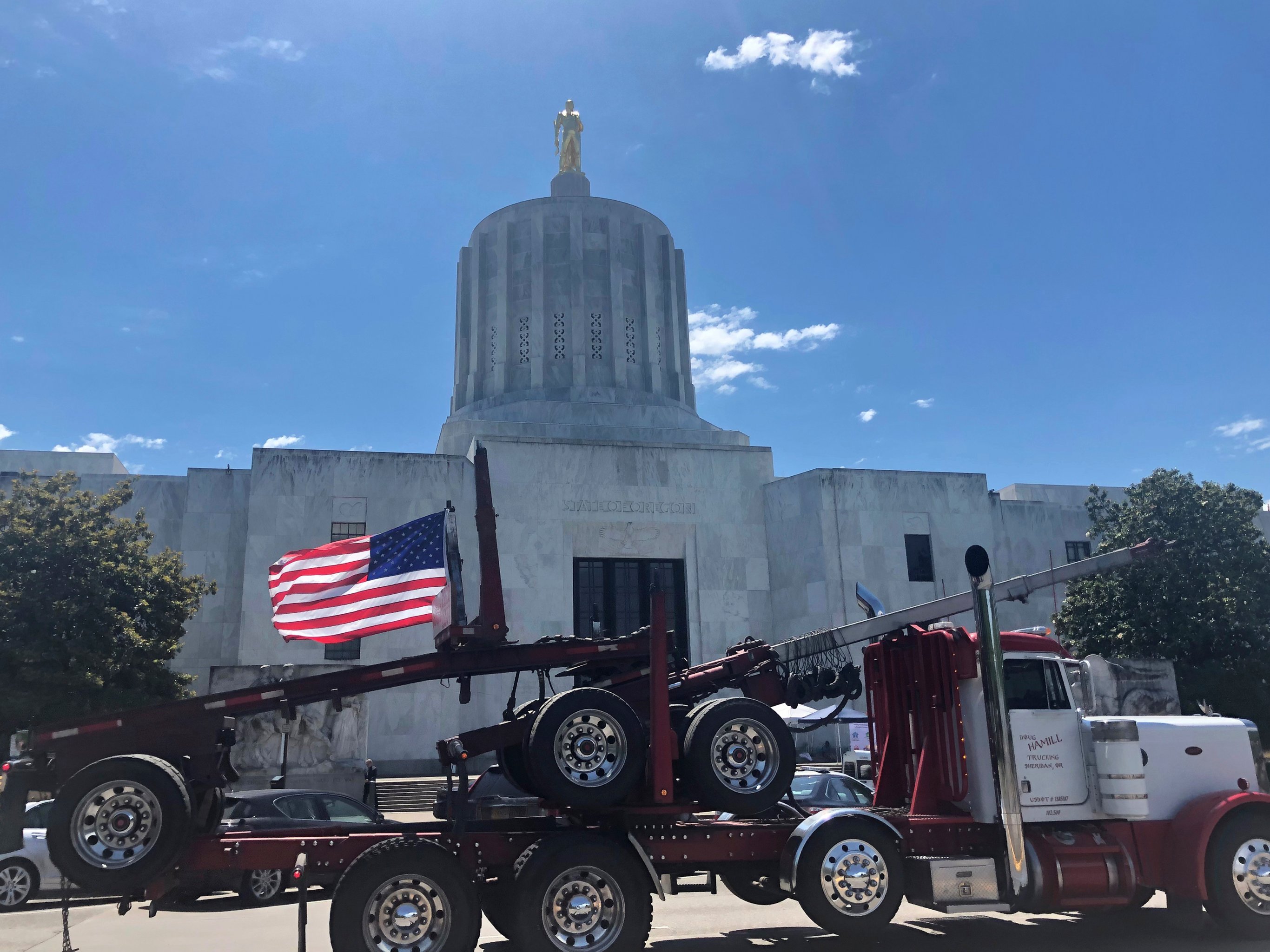 A truck moves around the Oregon state Capitol during a protest against climate bills that truckers say will put them out of business, in Salem, Oregon on 12 June 2019. Photo: Sarah Zimmerman / AP Photo