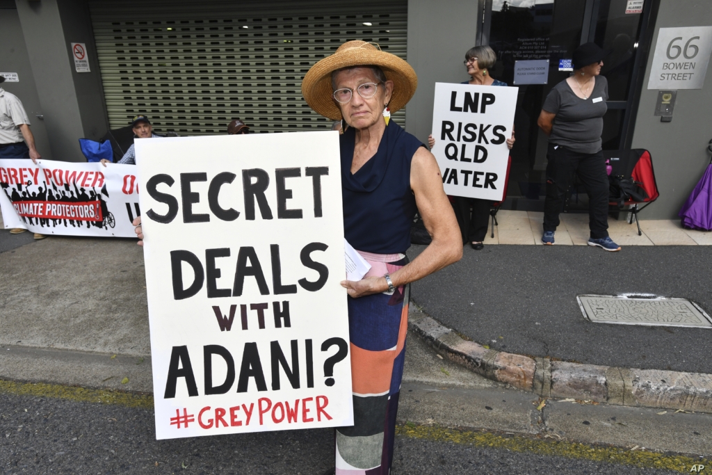 Anti-Adani coal mine protester Rae Sheridan is seen outside the LNP (Liberal National Party) headquarters in Brisbane, 11 April 2019. The protesters are trying to stop the building of Adani’s Carmichael coal mine. Photo: AP