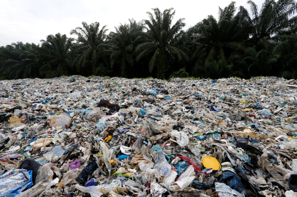 Plastic waste is piled outside an illegal recycling factory in Jenjarom, Kuala Langat, Malaysia, 14 October 2018. Photo: Lai Seng Sin / Reuters