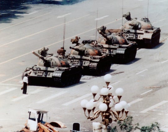 An anonymous protester, later known as  “Tank Man” confronts a People’s Liberation Army tank in Tiananmen Square, Beijing, China, on 5 June 1989. After the Tiananmen Square massacre, his fate remains unknown. TIME magazine later named him one of the 100 most influential people of the 20th century. Photo: Jeff Widener / AP