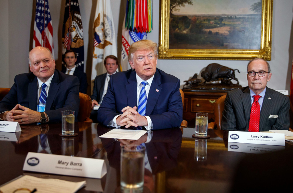 Donald Trump, Scott Pruitt, James Hackett, Larry Kudlow. President Donald Trump speaks during a meeting on 11 May 2018 with automotive executives in the Roosevelt Room of the White House, a few months before the administration rolled back Obama-era fuel-efficiency standards, one of a number of giveaways to the fossil-fuel industry. From left, Environmental Protection Agency administrator Scott Pruitt, Ford CEO James Hackett, Trump, and White House chief economic adviser Larry Kudlow. Photo: Evan Vucci / AP / REX / Shutterstock (9668793i)