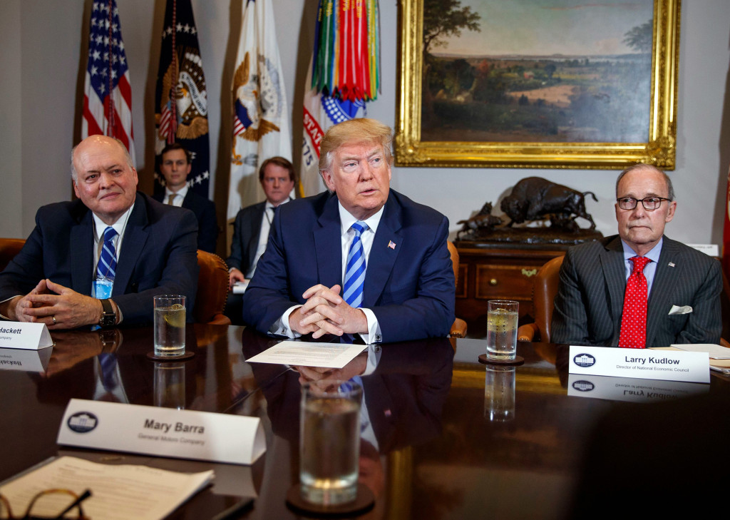 Donald Trump, Scott Pruitt, James Hackett, Larry Kudlow. President Donald Trump speaks during a meeting on 11 May 2018 with automotive executives in the Roosevelt Room of the White House, a few months before the administration rolled back Obama-era fuel-efficiency standards, one of a number of giveaways to the fossil-fuel industry. From left, Environmental Protection Agency administrator Scott Pruitt, Ford CEO James Hackett, Trump, and White House chief economic adviser Larry Kudlow. Photo: Evan Vucci / AP / REX / Shutterstock (9668793i)