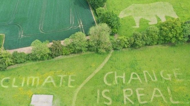 Aerial view of a yard with the words “Climate change is real”, mowed into the grass by 18-year-old Ollie Nancarrow on 2 June 2019. The teen attempted to catch the eye of Donald Trump on the grounds of his family home just outside Hatfield Heath, Essex, England, under the flight path of Air Force One. Photo: Ollie Nancarrow