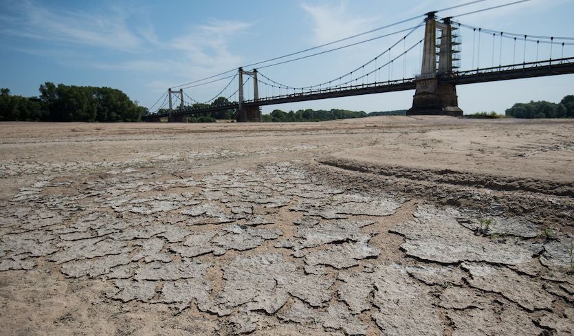 A dry part of the bed of the River Loire at Montjean-sur-Loire, France, on 24 July 2019, as drought conditions prevail over much of western Europe. Photo: Loic Venance / AFP / Getty Images