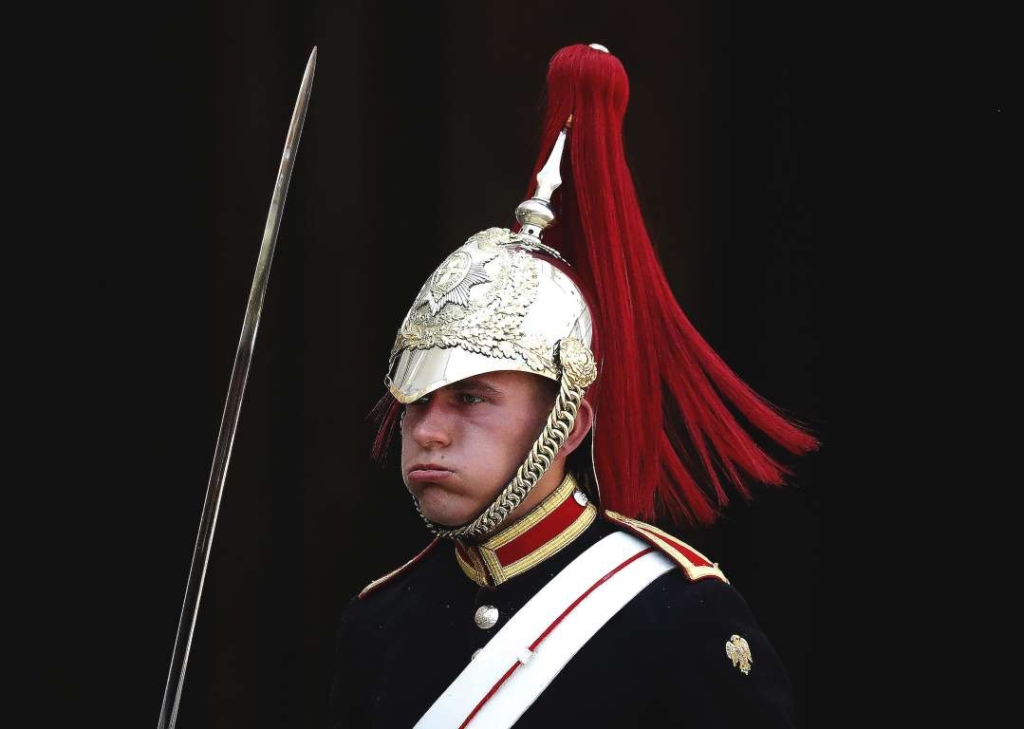 A member of the Queen’s Lifeguard marches at Horseguards as temperatures rise far above 30 Celsius in London, on 25 July 2019. Photo: Frank Augstein / AP Photo