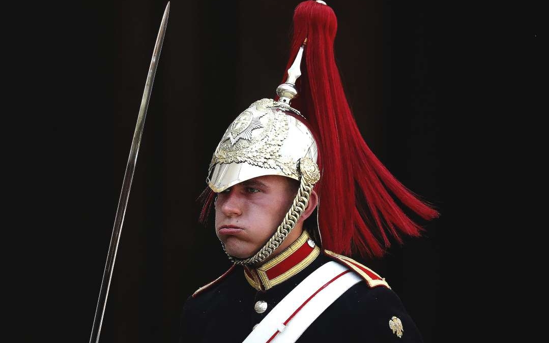 A member of the Queen's Lifeguard marches at Horseguards as temperatures rise far above 30 Celsius in London, on 25 July 2019. Photo: Frank Augstein / AP Photo