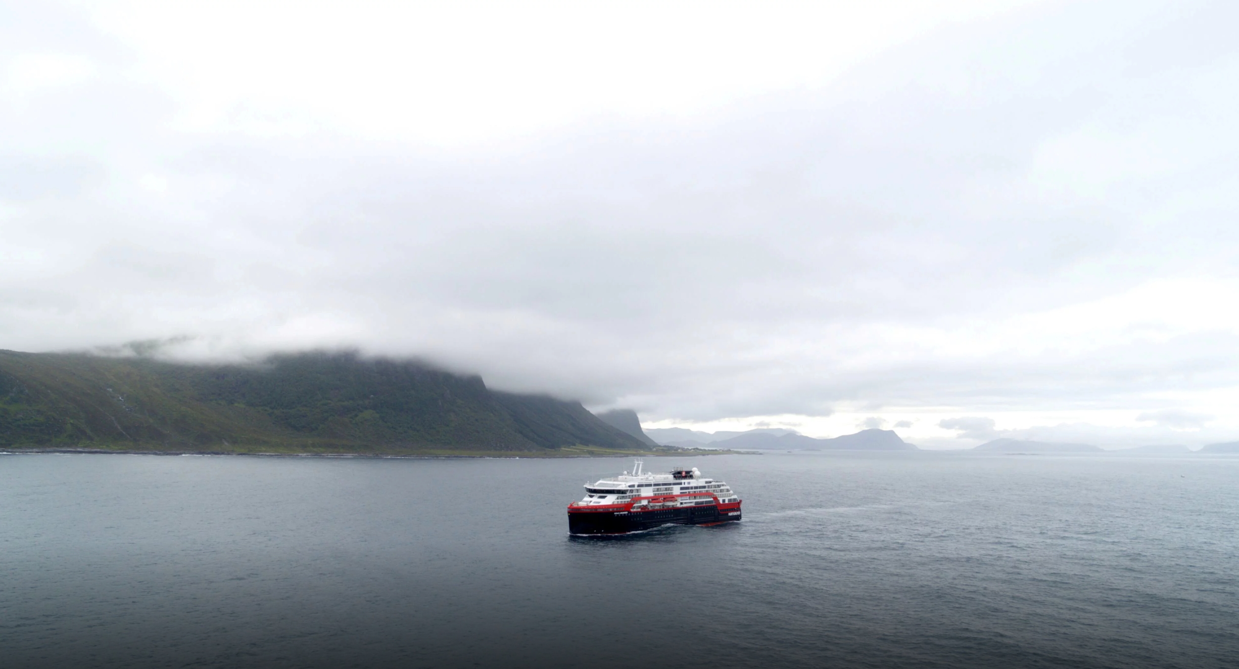 Hurtigruten’s cruise ship MS Roald Amundsen is seen in the sea near Ulsteinvik, Norway, on 1 July 2019. The Roald Amundsen is the world’s first cruise ship propelled partially by battery power and is set to head out from northern Norway on its maiden voyage, cruise operator Hurtigruten said on Monday. The hybrid expedition cruise ship can take 500 passengers and is designed to sail in harsh climate waters. Named after the Norwegian explorer who navigated the Northwest Passage in 1903-1906 and was first to reach the South Pole in 1911, the ship heads for the Arctic from Tromsø this week and will sail the Northwest Passage to Alaska before heading south, reaching Antarctica in October 2019. Photo: Hurtigruten / Reuters