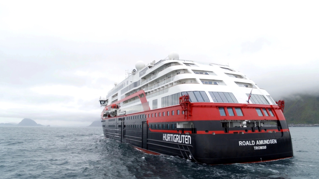 Hurtigruten’s cruise ship “MS Roald Amundsen” is seen in the sea near Ulsteinvik, Norway, on 1 July 2019. The “Roald Amundsen” is the world’s first cruise ship propelled partially by battery power and is set to head out from northern Norway on its maiden voyage, cruise operator Hurtigruten said on Monday. The hybrid expedition cruise ship can take 500 passengers and is designed to sail in harsh climate waters. Named after the Norwegian explorer who navigated the Northwest Passage in 1903-1906 and was first to reach the South Pole in 1911, the ship heads for the Arctic from Tromsø this week and will sail the Northwest Passage to Alaska before heading south, reaching Antarctica in October 2019. Photo: Hurtigruten / Reuters