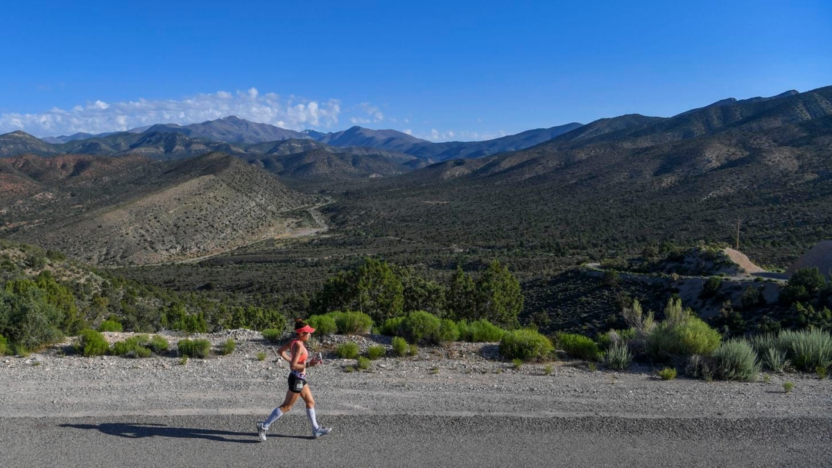 Julie Bertoia, a 50-kilometer runner, descends into the lower part of the valley during the “Running with the Devil” race in the Mojave Desert. Photo: Jonathan Newton / The Washington Post