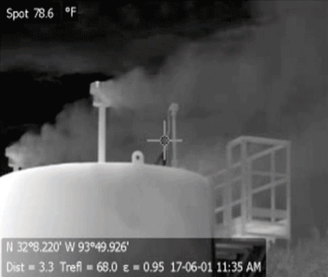 Gas storage tanks receiving natural gas from feeder pipelines before compression for transport in high-pressure pipelines at the Haynseville shale formation, Texas. This photo was taken with a forward-looking infrared (FLIR) camera tuned to the infrared spectrum of methane, allowing visualization of methane, which is invisible in the normal camera view and to the naked eye. Photo: Sharon Wilson / Howarth, 2019 / Biogeosciences