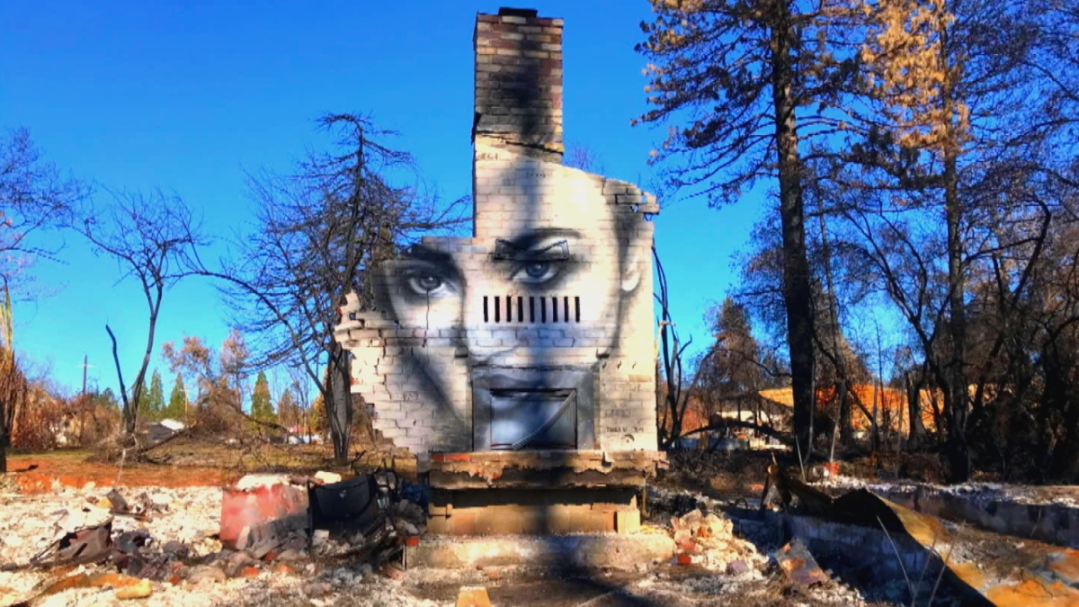An artist, moved by what was left behind of his friend's home after a wild fire, used the site as a canvas. Shane Grammer said he was devastated to find out how many people he knows were left homeless by the Camp Fire in Paradise, California. His friend, Shane Edwards, agreed to let him create a mural on what remained of his burned-down home. After three hours, Grammer had created a striking image of a beautiful woman that is giving people hope on 4 January 2019. Photo: Inside Edition