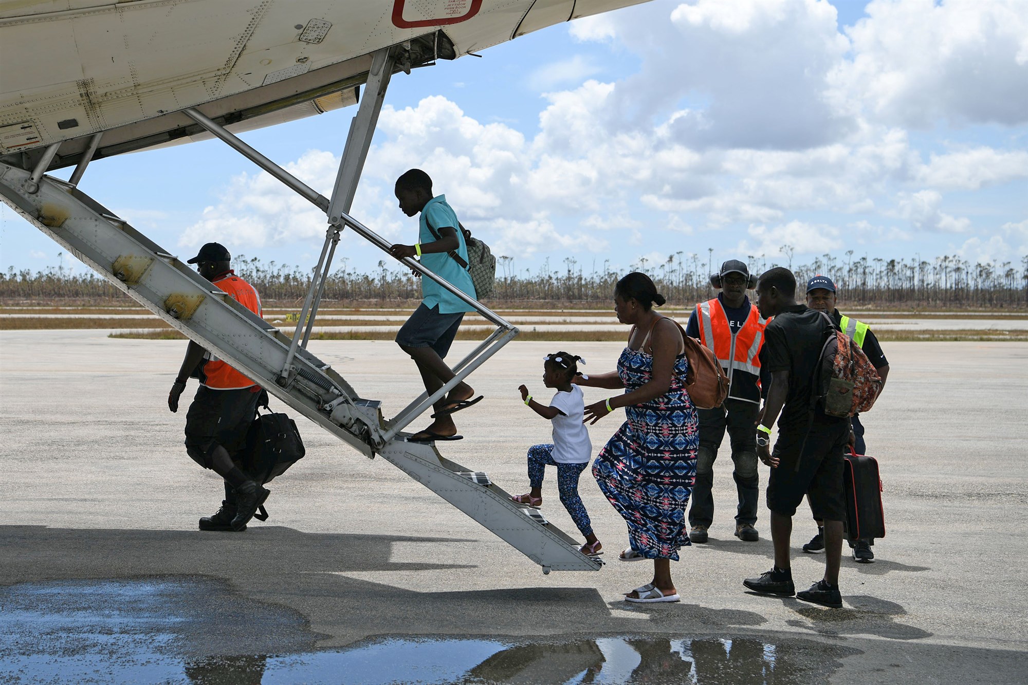 Abaco residents are evacuated from the island at the airport in the wake of Hurricane Dorian in Marsh Harbour, Great Abaco, Bahamas on 8 September 2019. Photo: Loren Elliott / Reuters