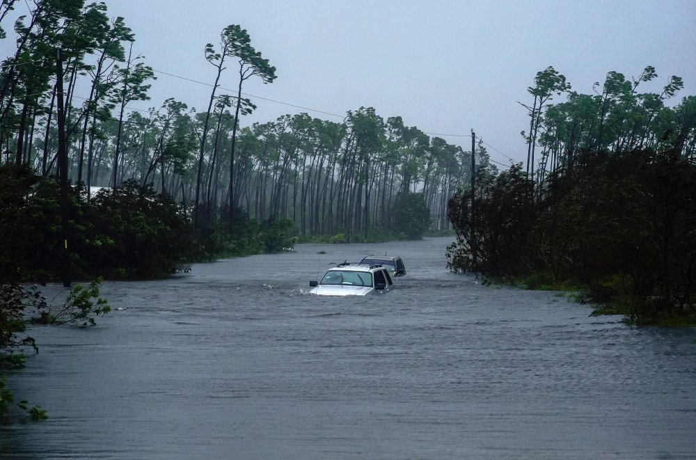 Cars are submerged in floodwaters from Hurricane Dorian in Freeport, Bahamas, Tuesday, 3 September 2019. Dorian inched northwestward after being stationary over the Bahamas, where its relentless winds have caused catastrophic damage and flooding. Photo: Ramon Espinosa / AP Photo