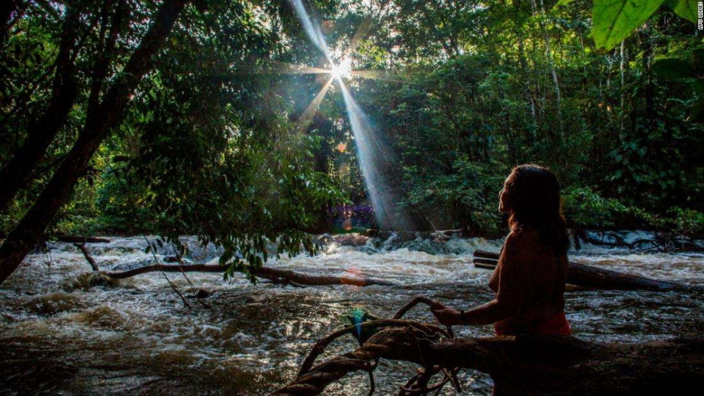 Chief Ajareaty Waiapi, of the Kwapo'ywyry village in the Brazilian state of Amapa, stands by the Rio Onca river looking out into the forest, in August 2019. Photo: Apu Gomes / CNN