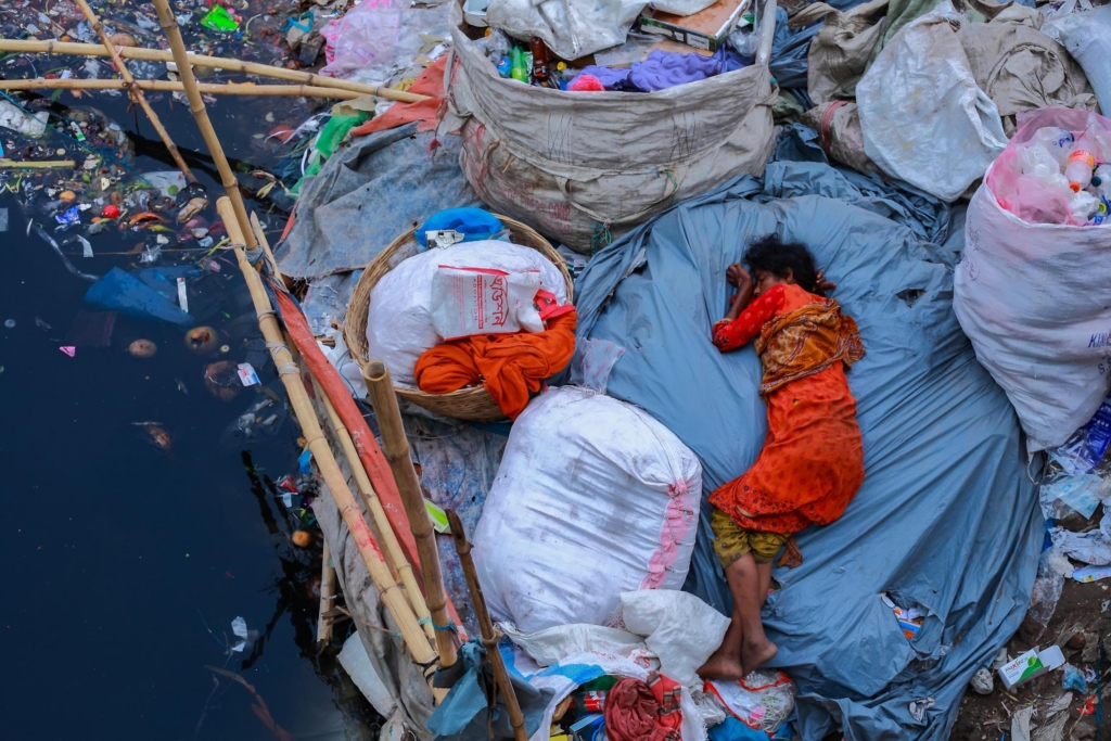 This image, “Sleep Fatigue”, won photographer Amdad Hossain an honorable mention in the Environmental Photographer of the Year 2019 award. It shows A woman sleeping on garbage along a dirty riverbank in Dhaka, Bangladesh. Photo: Amdad Hossain