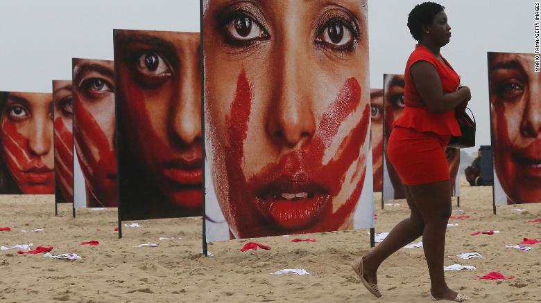 Images of models portraying women who have been abused, at a demonstration opposing violence against women on Copacabana beach on 6 June 2016 in Rio de Janeiro, Brazil. Photo: CNN