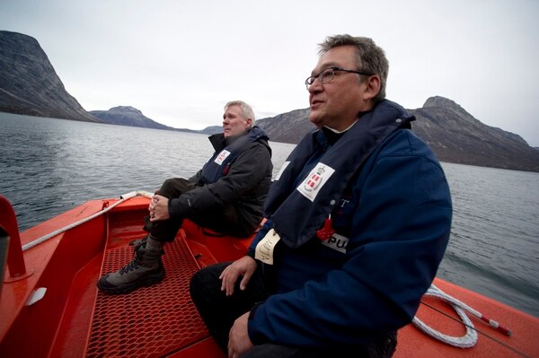In late 2010, then-Secretary of the Navy Ray Mabus, right, and then-Prime Minister of Greenland Jakob Edvard Kuupik Kleist spoke on board a search and rescue patrol boat off the coast of Nuuk, Greenland. Mabus had been meeting with global leaders and scientists to discuss the environmental impacts of climate change. Photo: U.S. Navy