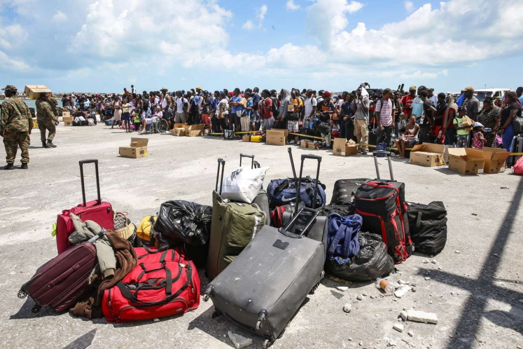 People wait to be evacuated in private boats at the Marsh Harbor Port in devastated Grand Abaco Island on 6 September 2019. Photo: Jose Jimenez / Getty Images