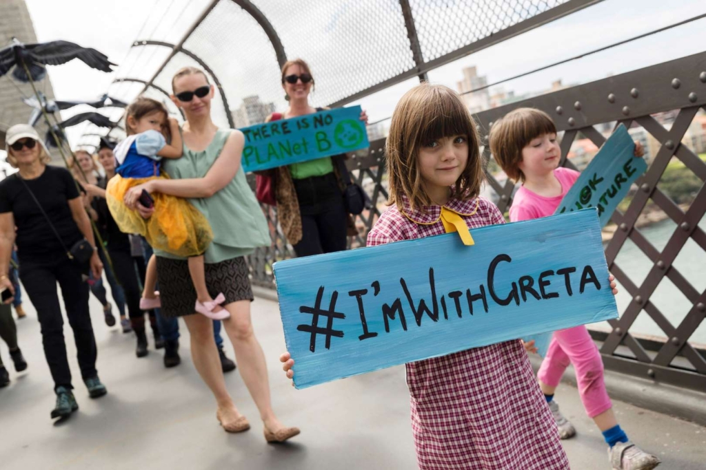 A girl carries a sign that reads #ImWithGreta while marching in the Global Climate Strike in Sydney, Australia, 20 September 2019. Photo: Brook Mitchell / Getty Images