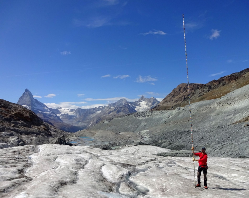 During the summer of 2019, 8 metres of ice melted at the snout of the Findelen glacier in the Swiss Alps, an amount strikingly illustrated by a pole used for mass-balance measurements. Photo: Matthias Huss
