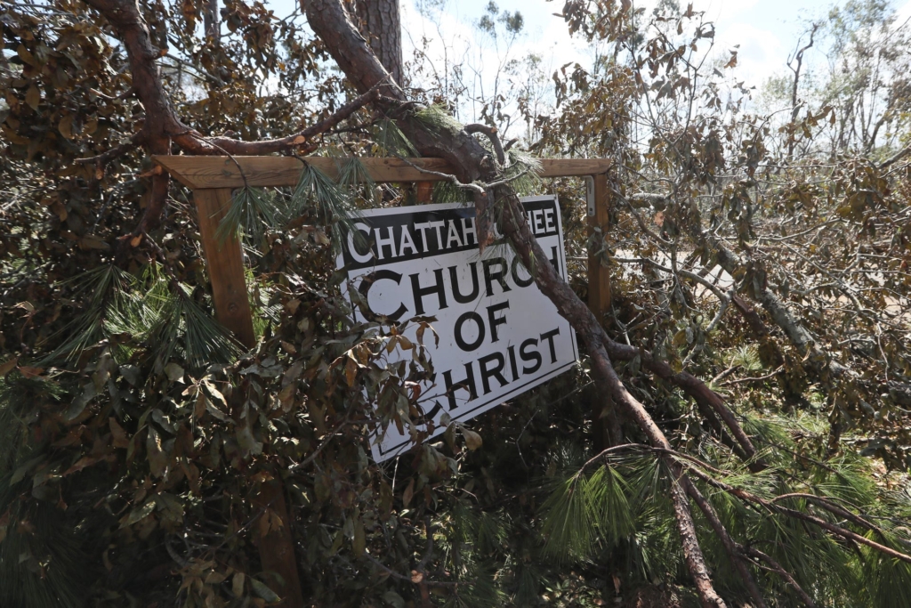 Fallen trees cover the signage of the Chattahoochee Church of Christ on 15 October 2018, after the passage of Hurricane Michael. Photo: Tallahassee Democrat