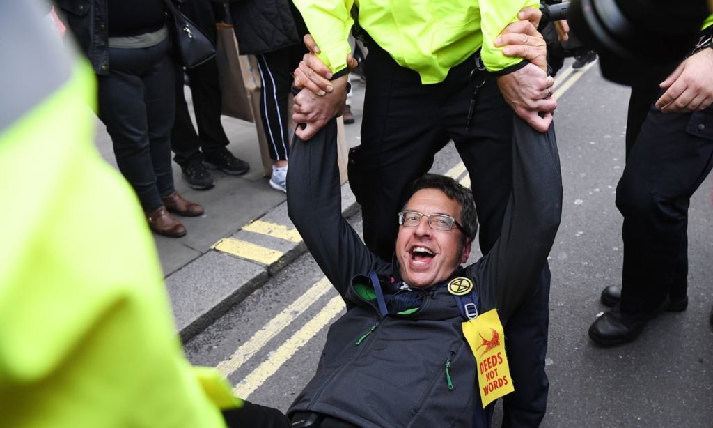 Journalist George Monbiot being arrested by police during an Extinction Rebellion protest in London on 16 October 2019. Photo: Facundo Arrizabalaga / EPA / The Guardian