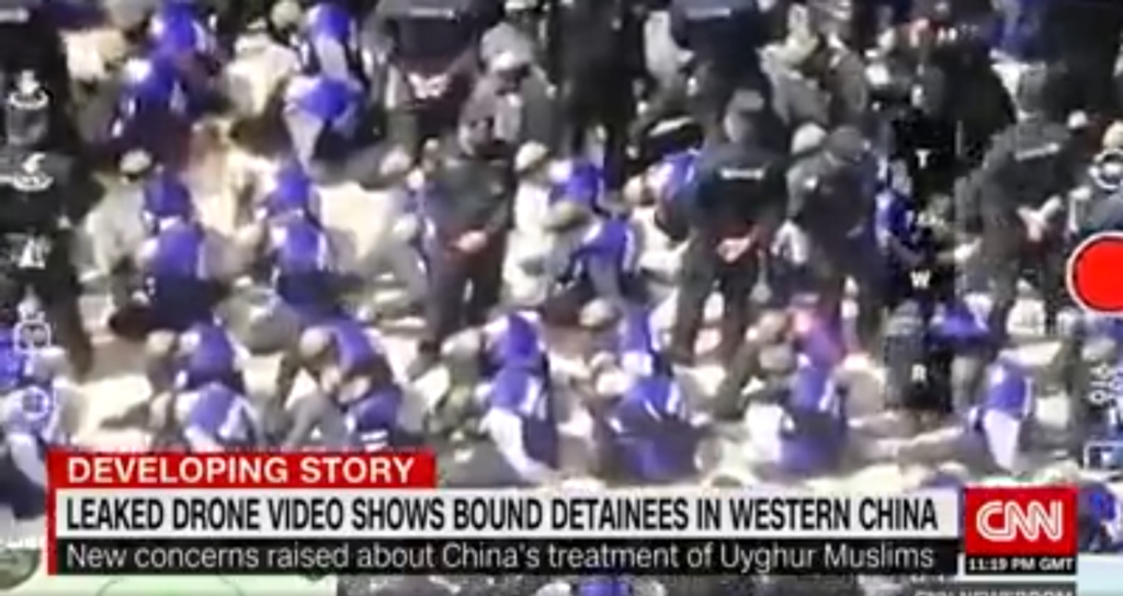 Screenshot from a drone video showing hundreds of blindfolded men being led from a train in China, posted anonymously on 17 September 2019. The video raises new concerns over the ongoing crackdown on Muslim Uyghurs in the far western region of Xinjiang. Video: War on Fear (战斗恐惧)