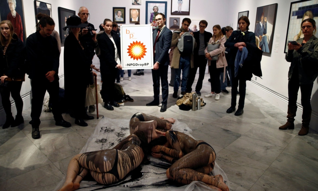 Semi-naked environmental campaigners have been drenched in fake oil at the National Portrait Gallery to protest against its sponsorship by BP, 20 October 2019. One activist said, “It’s atrocious that BP can try to cover themselves up by investing in art”. Photo: Henry Nicholls / Reuters