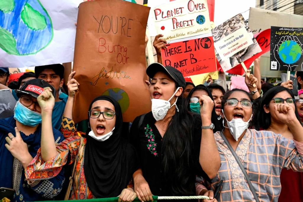 Young people march in a protest for climate action in Lahore, Pakistan, during the Global Climate Strike on 20 September 2019. Photo: Arif Ali / AFP / Getty Images