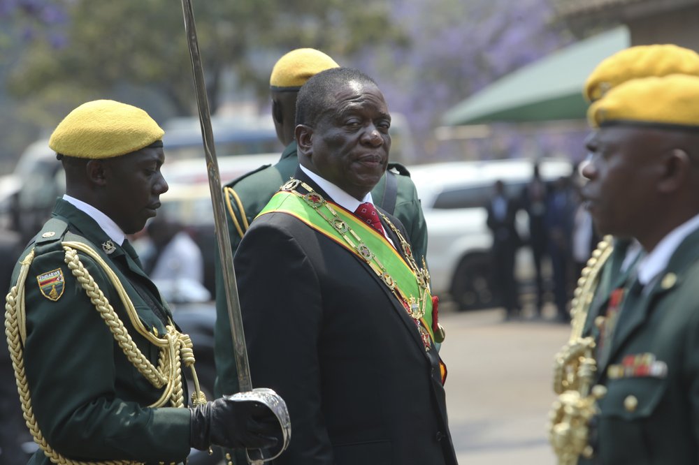 Zimbabwean President Emmerson Mnangagwa inspects the guard of honour during the opening session of parliament in Harare, 1 October 2019. Zimbabwe’s opposition lawmakers have walked out of Parliament as President Emmerson Mnangagwa presented his state of the nation address, a sign of the political tensions still gripping the country. Photo: Tsvangirayi Mukwazhi / Associated Press
