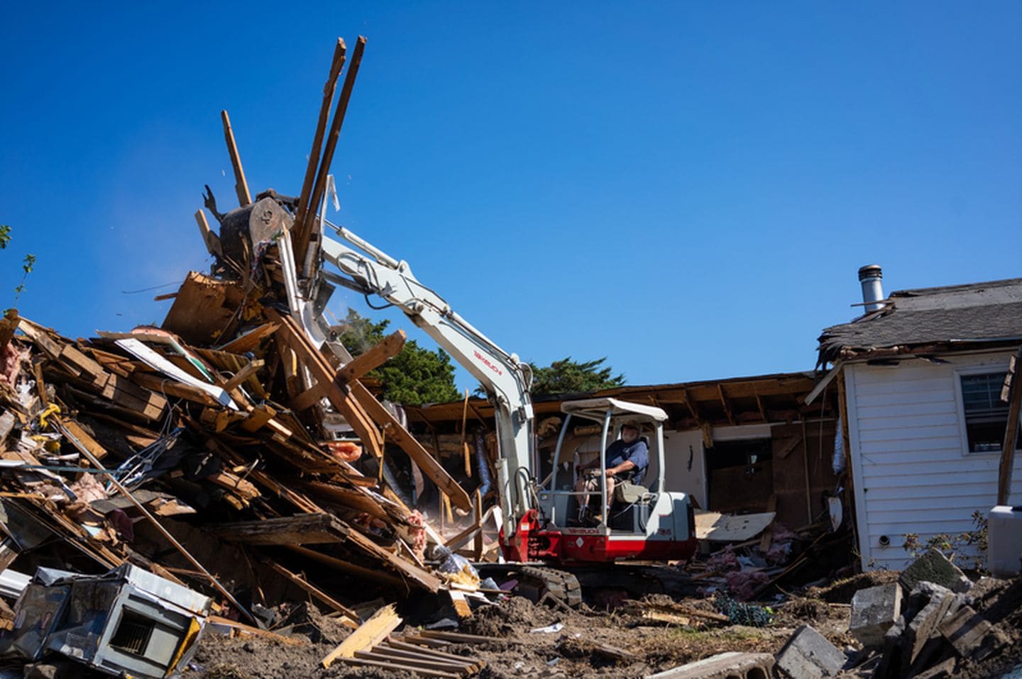 The home of Edward and Stella O’Neal is torn down due to damage caused by flooding during Hurricane Dorian in Ocracoke, North Carolina. Photo: Daniel Pullen / The Washington Post