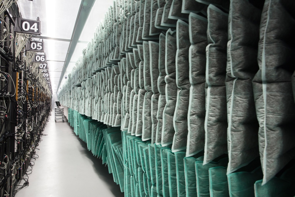 Racks of computers used for Bitcoin mining line a hallway inside Genesis Mining’s Enigma facility in Iceland. Photo: Lisa Barnard