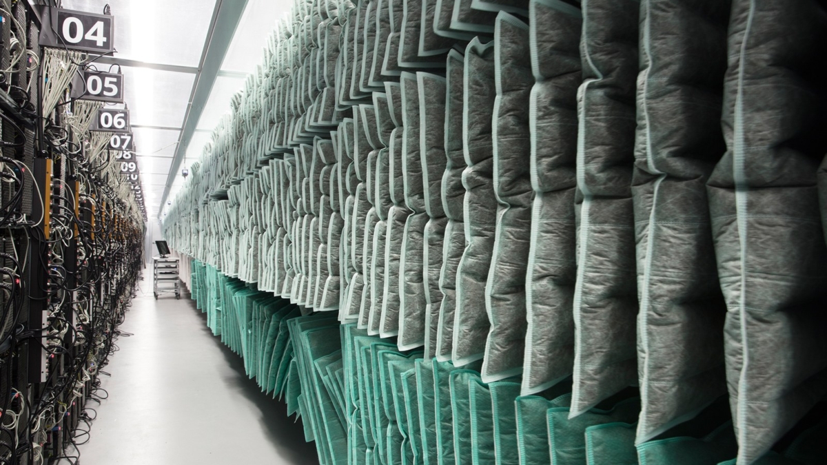 Racks of computers used for Bitcoin mining line a hallway inside Genesis Mining’s Enigma facility in Iceland. Photo: Lisa Barnard