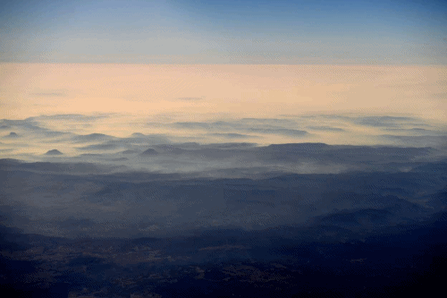 Aerial view of smoke from bushfires blanketing mountain ranges, as seen during a commercial flight over northern New South Wales, 16 November 2019. Photo: Tracy Nearmy / Reuters