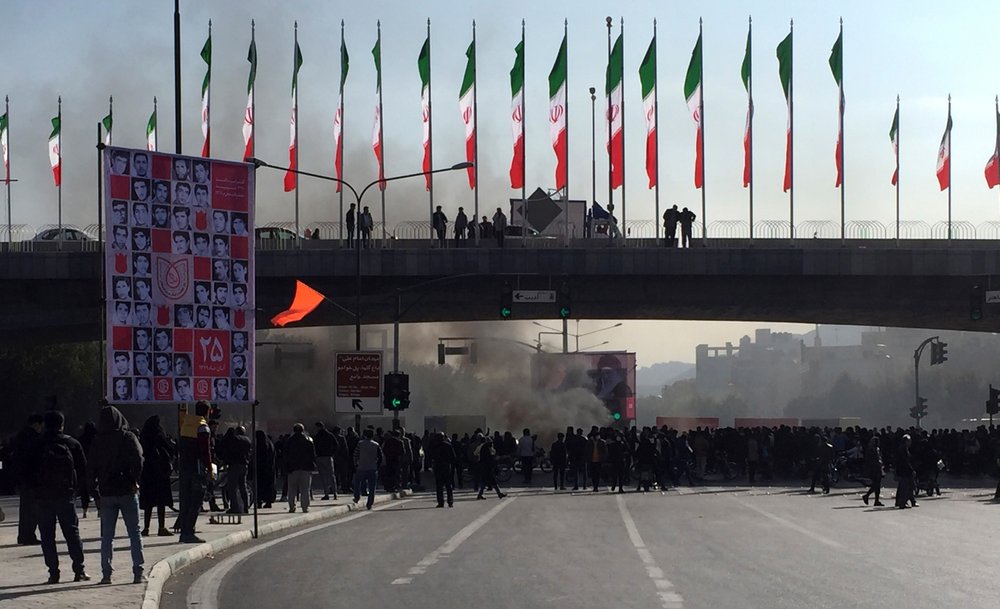 Smoke rises during a protest after authorities raised gasoline prices, in the central city of Isfahan, Iran, Saturday, 16 November 2019. Demonstrators angered by a 50 percent increase in government-set gasoline prices blocked traffic in major cities and occasionally clashed with police Saturday after a night of demonstrations punctuated by gunfire. Photo: AP Photo