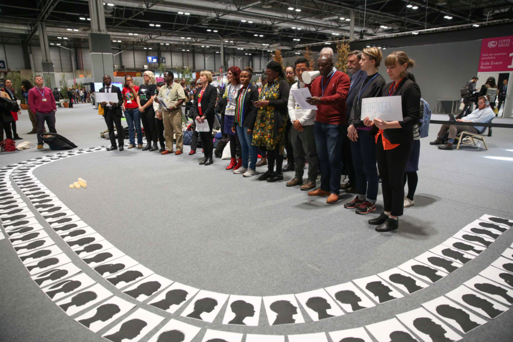 At COP25, members of civil society pay tribute to environmental activists who were killed in the defence of the environment, 9 December 2019. Photo: Kiara Worth / IISD / ENB