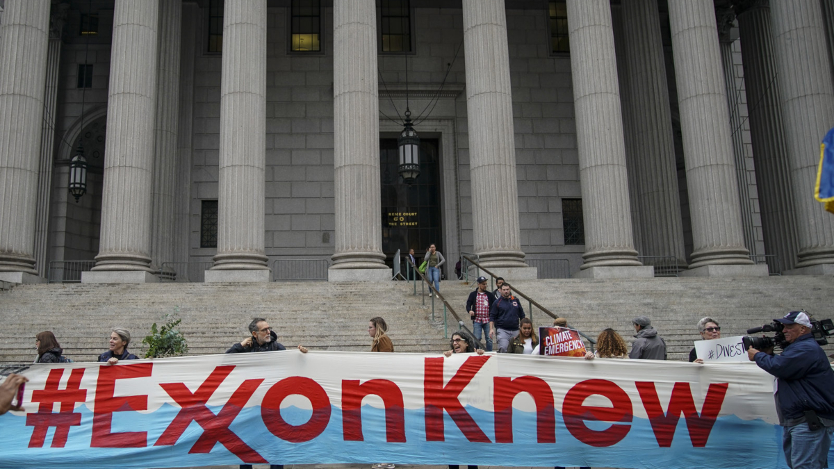 Environmental activists rally outside of New York Supreme Court in October 2019 in Manhattan, on the first day of the trial accusing ExxonMobil of misleading shareholders about its climate change accounting. Photo: Drew Angerer / Getty Images