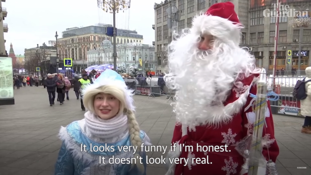 A man dressed as Father Christmas and a woman lament the snow that was trucked in to Moscow to replace the absent winter snowfall, 29 December 2019. This winter is the warmest December since 1886 . Photo: The Guardian
