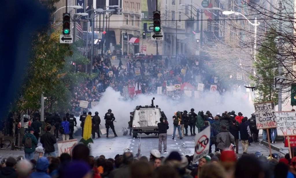 Seattle police use tear gas to push back World Trade Organization protesters in downtown Seattle on 30 November 1999. Saturday, 30 November 2019 marked 20 years since tens of thousands of protesters converged on Seattle and disrupted a major meeting of the World Trade Organization. The protesters’ message was amplified not just by their vast numbers but by the response of overwhelmed police, who fired tear gas and plastic bullets and arrested nearly 600 people. Two decades later, many of their causes are still relevant. Photo: Eric Draper / AP
