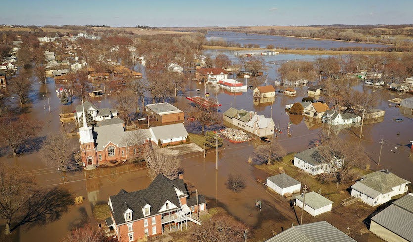 Homes and businesses are surrounded by floodwater on 20 March 2019 in Hamburg, Iowa. Several Midwest states battled some of the worst flooding they have experienced in decades as rains and snowmelt triggered by an intense late-winter storm inundated rivers and streams. Photo: Scott Olson / Getty Images
