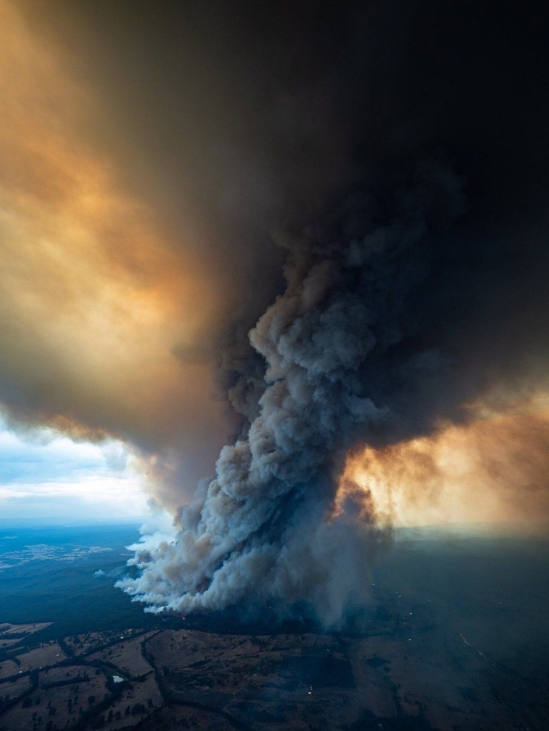 Aerial view of smoke rising from a bushfire burning at East Gippsland, Victoria, 2 January 2020. Photo: EPA / BBC News